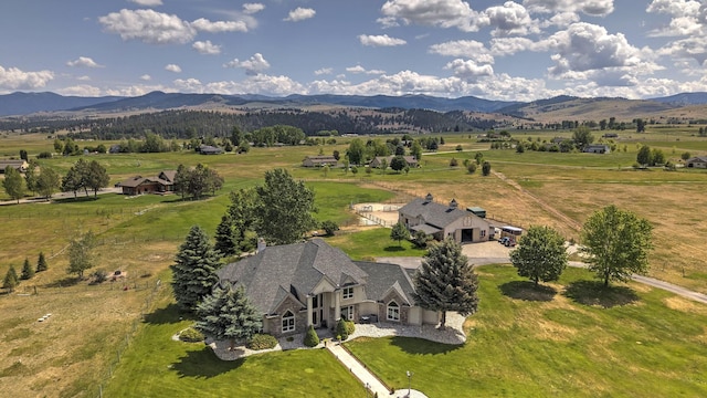 424 Saddle Ridge Rd, Hamilton, MT 59840 - aerial view of sparsely populated area featuring a mountainous background and agricultural land