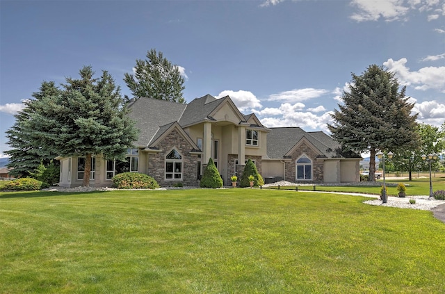 424 Saddle Ridge Rd, Hamilton, MT 59840 - view of front of home with stone siding, stucco siding, and a front lawn