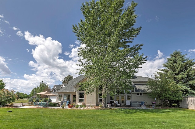 424 Saddle Ridge Rd, Hamilton, MT 59840 - back of property featuring a patio area, stucco siding, and roof with shingles