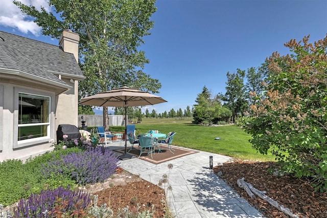 424 Saddle Ridge Rd, Hamilton, MT 59840 - view of green lawn featuring a patio