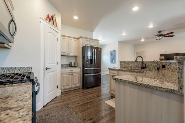 2110 Spring Wheat Loop, East Helena, MT 59635 - kitchen featuring appliances with stainless steel finishes, a ceiling fan, dark wood finished floors, recessed lighting, and light stone counters
