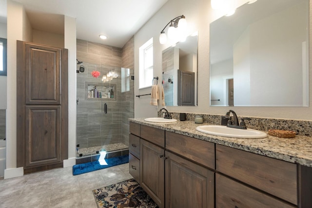 2110 Spring Wheat Loop, East Helena, MT 59635 - full bath with double vanity, a stall shower, and tile patterned floors