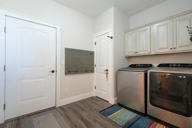 2110 Spring Wheat Loop, East Helena, MT 59635 - laundry room featuring cabinet space, washer and dryer, and dark wood-style floors