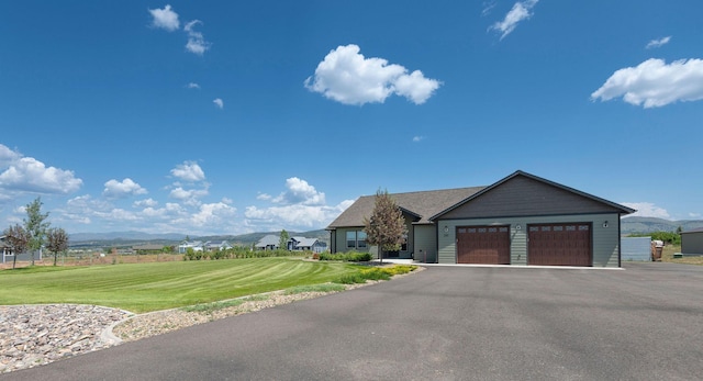 2110 Spring Wheat Loop, East Helena, MT 59635 - ranch-style house with a garage, a front lawn, driveway, and a mountain view