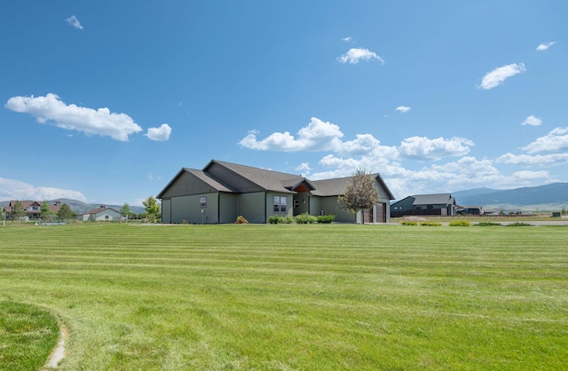 2110 Spring Wheat Loop, East Helena, MT 59635 - view of grassy yard with a mountain view
