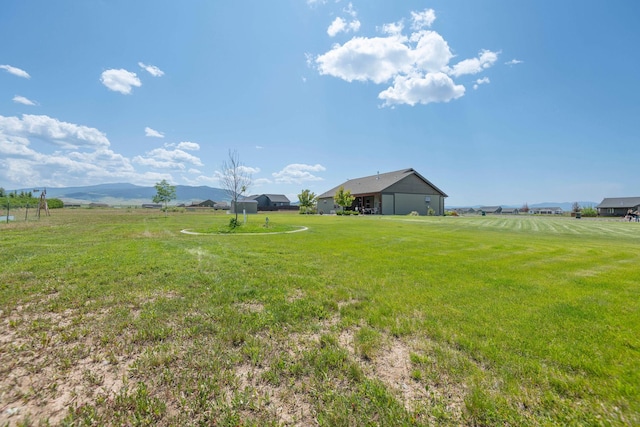 2110 Spring Wheat Loop, East Helena, MT 59635 - view of green lawn featuring a mountain view