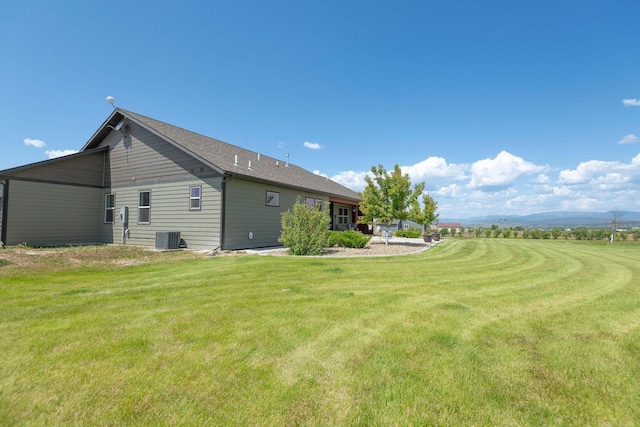 2110 Spring Wheat Loop, East Helena, MT 59635 - rear view of house featuring a lawn