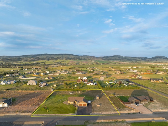 2110 Spring Wheat Loop, East Helena, MT 59635 - aerial perspective of suburban area with a mountain backdrop and property boundaries highlighted