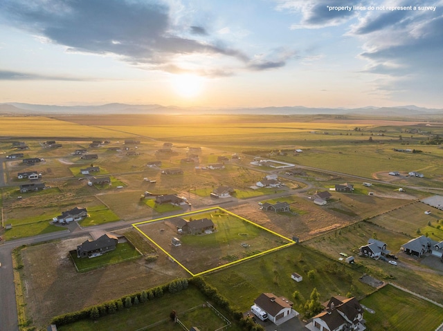 2110 Spring Wheat Loop, East Helena, MT 59635 - aerial view of sparsely populated area with property parcel outlined and a mountainous background