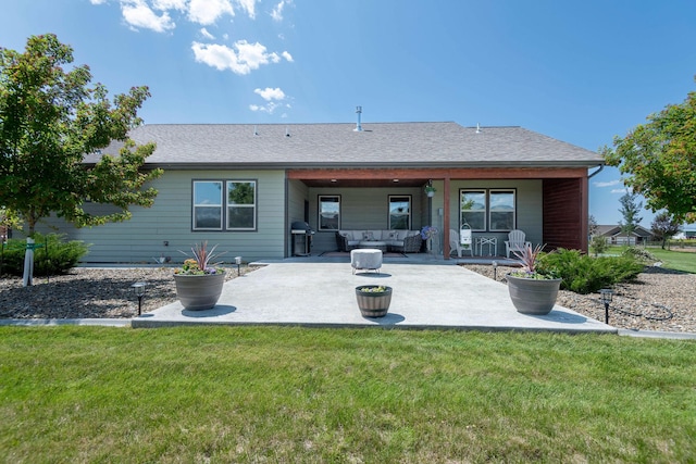 2110 Spring Wheat Loop, East Helena, MT 59635 - back of property with outdoor lounge area, a patio, a lawn, and a shingled roof