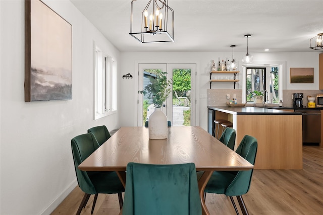 128 Mallard Loop, Whitefish, MT 59937 - dining room featuring a chandelier and light wood-type flooring