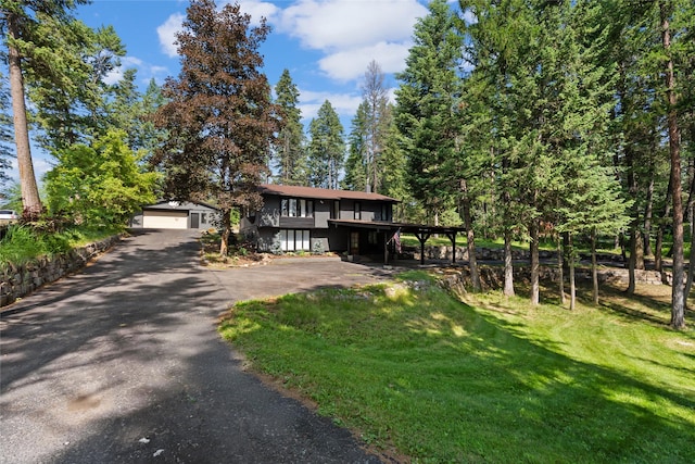 128 Mallard Loop, Whitefish, MT 59937 - view of front facade with a front yard, driveway, and a garage