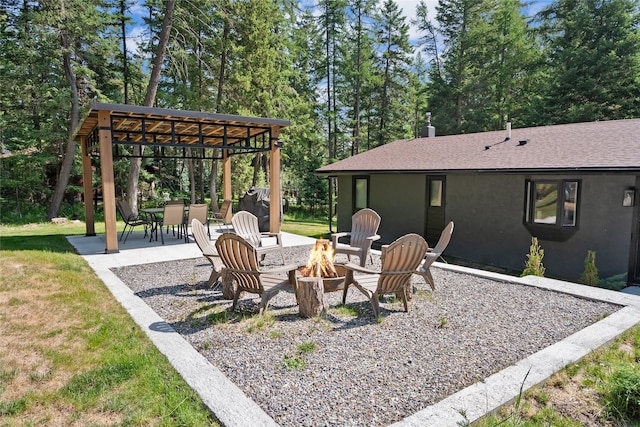 128 Mallard Loop, Whitefish, MT 59937 - view of patio / terrace featuring an outdoor fire pit