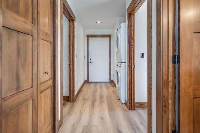 309 Stanton St, Plains, MT 59859 - hall with stacked washing machine and dryer, light wood-type flooring, and recessed lighting