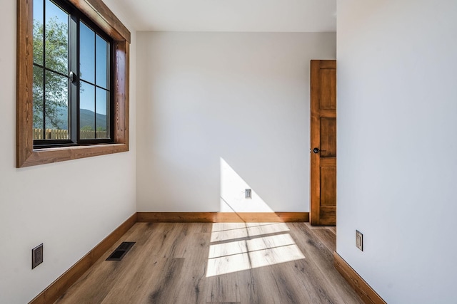309 Stanton St, Plains, MT 59859 - unfurnished room featuring wood finished floors