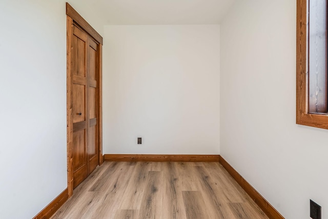309 Stanton St, Plains, MT 59859 - unfurnished room with light wood-style flooring and baseboards