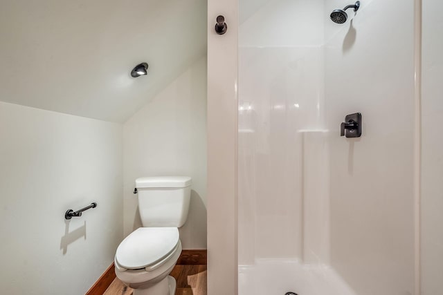 309 Stanton St, Plains, MT 59859 - full bathroom with a shower, wood finished floors, and vaulted ceiling
