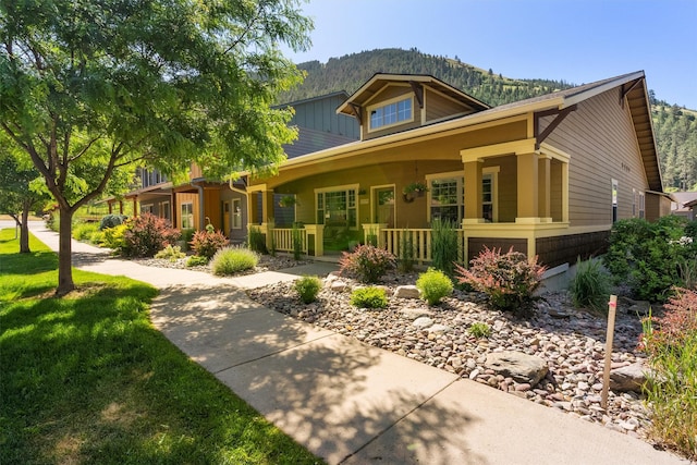 1219 Lolo St, Missoula, MT 59802 - view of front of house with covered porch and a mountain view