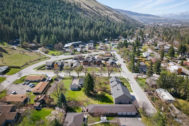 1219 Lolo St, Missoula, MT 59802 - aerial overview of property's location featuring a mountain backdrop and nearby suburban area
