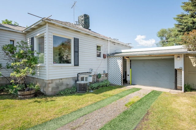 2515 S Higgins Ave, Missoula, MT 59801 - view of front facade featuring driveway, a front lawn, a chimney, and a garage