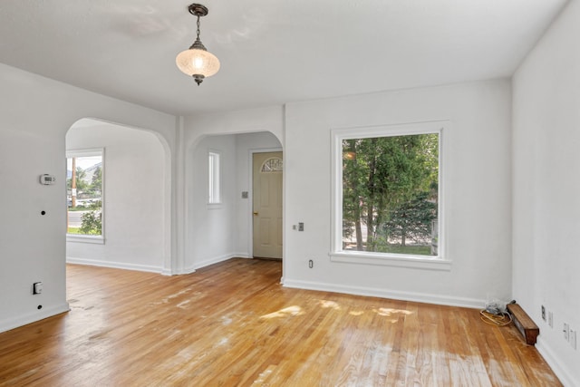 2515 S Higgins Ave, Missoula, MT 59801 - unfurnished room featuring arched walkways and light wood-type flooring