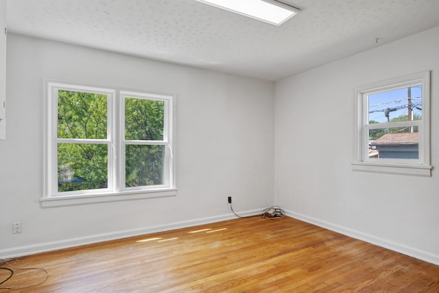 2515 S Higgins Ave, Missoula, MT 59801 - spare room featuring light wood-style floors and a textured ceiling
