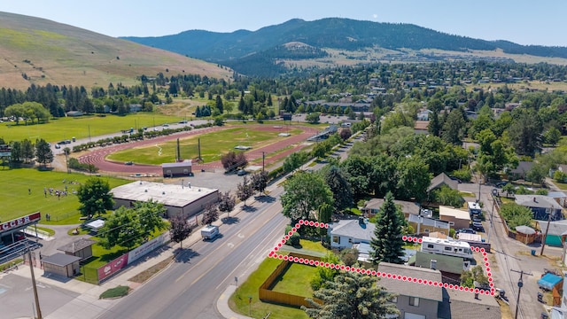 2515 S Higgins Ave, Missoula, MT 59801 - aerial view of property and surrounding area with a mountain backdrop and property parcel outlined