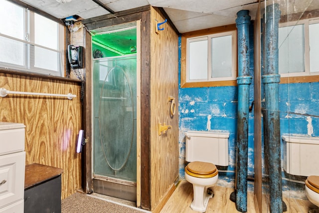 2515 S Higgins Ave, Missoula, MT 59801 - bathroom featuring a stall shower and wood finished floors