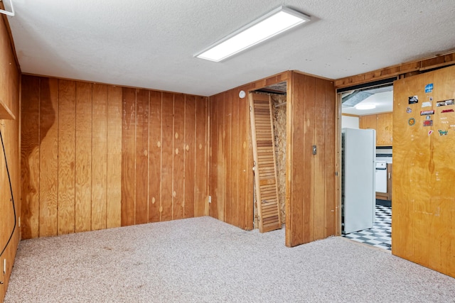 2515 S Higgins Ave, Missoula, MT 59801 - unfurnished room featuring wooden walls, carpet floors, and a textured ceiling