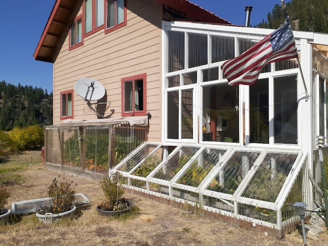 30 Idle Hour Way, Clinton, MT 59825 - view of property exterior featuring a sunroom