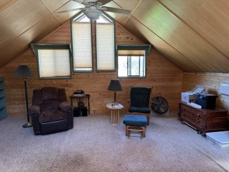 30 Idle Hour Way, Clinton, MT 59825 - sitting room featuring wood walls, vaulted ceiling, ceiling fan, carpet floors, and wooden ceiling