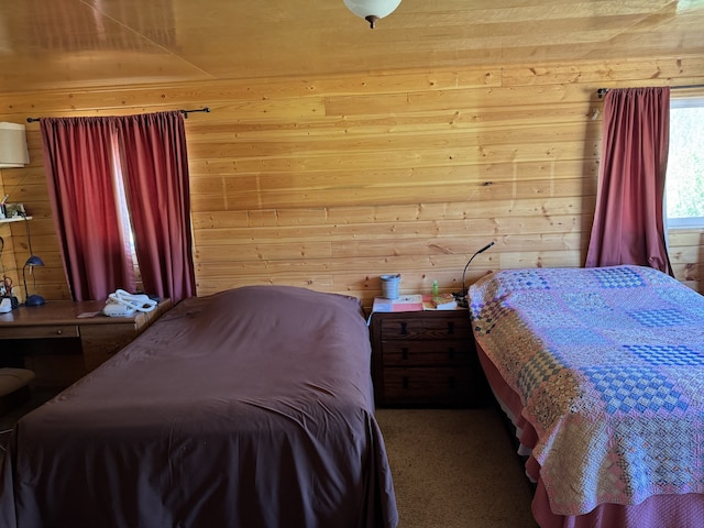 30 Idle Hour Way, Clinton, MT 59825 - bedroom featuring wood walls and carpet floors
