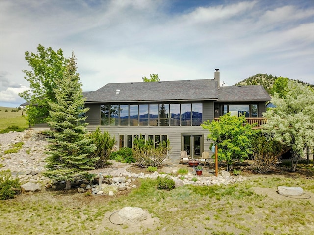 1087 Sunny Vista Rd, Helena, MT 59602 - back of property featuring a patio area and a chimney