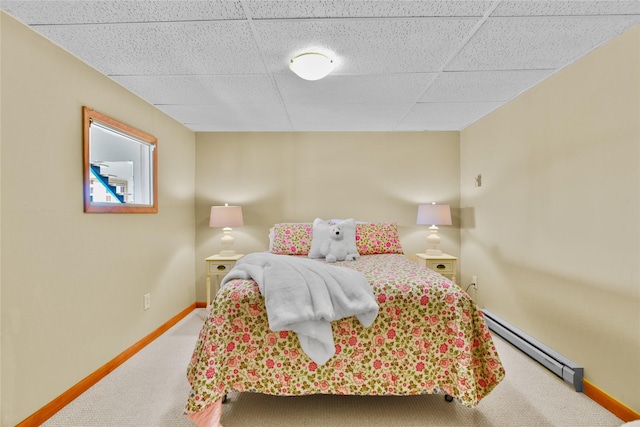 1087 Sunny Vista Rd, Helena, MT 59602 - bedroom featuring baseboard heating, carpet flooring, and a paneled ceiling