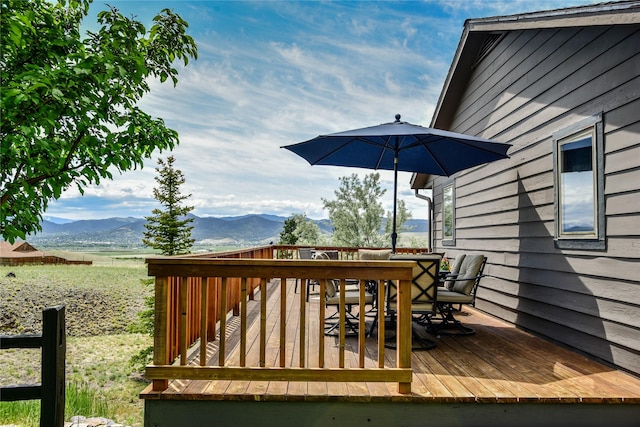 1087 Sunny Vista Rd, Helena, MT 59602 - deck featuring outdoor dining area and a mountain view