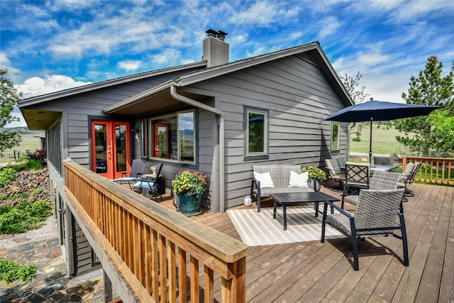 1087 Sunny Vista Rd, Helena, MT 59602 - wooden terrace with french doors and an outdoor living space
