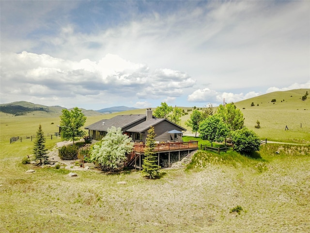 1087 Sunny Vista Rd, Helena, MT 59602 - back of house featuring a deck with mountain view and a rural view