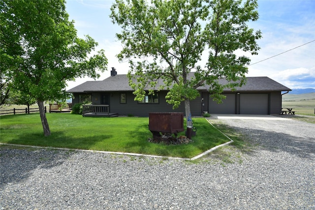 1087 Sunny Vista Rd, Helena, MT 59602 - ranch-style home featuring driveway, a chimney, and an attached garage