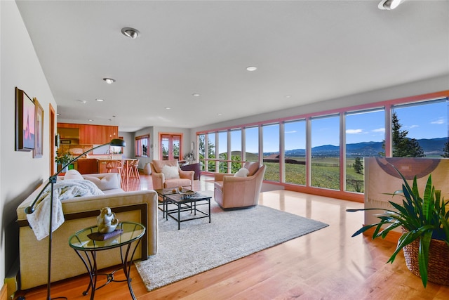 1087 Sunny Vista Rd, Helena, MT 59602 - living room featuring a mountain view, recessed lighting, and wood finished floors