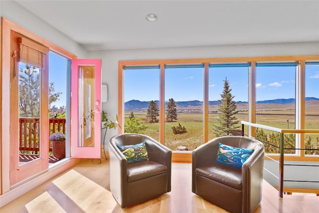 1087 Sunny Vista Rd, Helena, MT 59602 - sunroom / solarium featuring a mountain view, recessed lighting, and wood finished floors