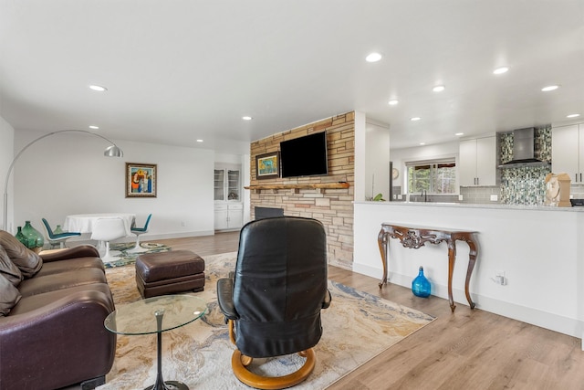 2709 Humble Rd, Missoula, MT 59804 - living area with wood finished floors, recessed lighting, and a fireplace