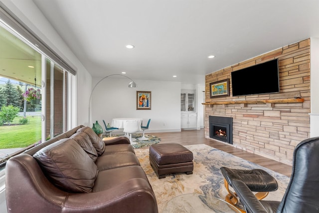 2709 Humble Rd, Missoula, MT 59804 - living area with wood finished floors, a fireplace, and recessed lighting