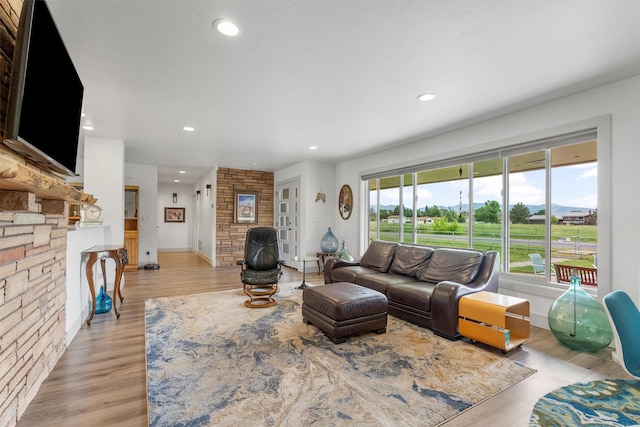 2709 Humble Rd, Missoula, MT 59804 - living area featuring plenty of natural light, a fireplace, recessed lighting, and light wood-style floors