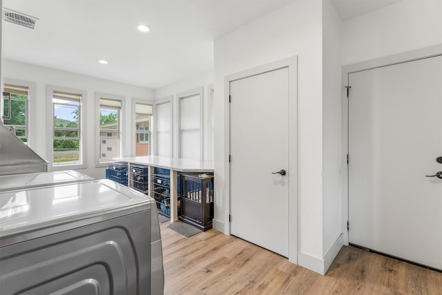 2709 Humble Rd, Missoula, MT 59804 - washroom featuring washing machine and clothes dryer, light wood finished floors, and recessed lighting