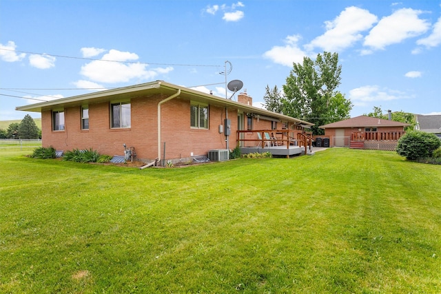 2709 Humble Rd, Missoula, MT 59804 - view of side of property with brick siding, a deck, and a chimney