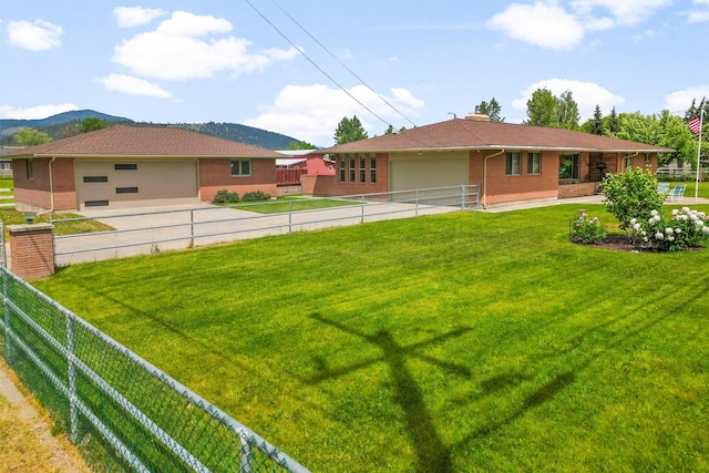 2709 Humble Rd, Missoula, MT 59804 - view of yard with an attached garage and driveway