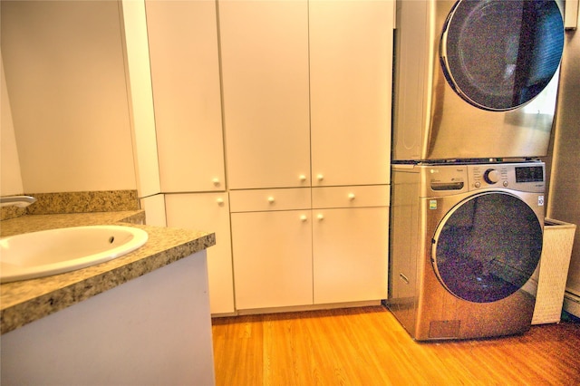 8319 Canyon Ferry Rd, Helena, MT 59602 - laundry area featuring stacked washer / drying machine and light wood-style floors
