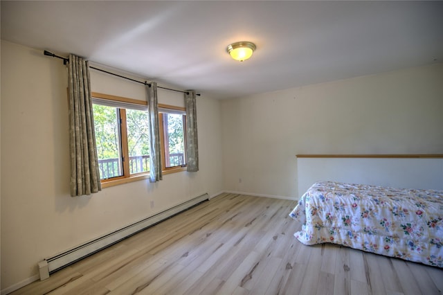 8319 Canyon Ferry Rd, Helena, MT 59602 - bedroom featuring baseboard heating and wood finished floors