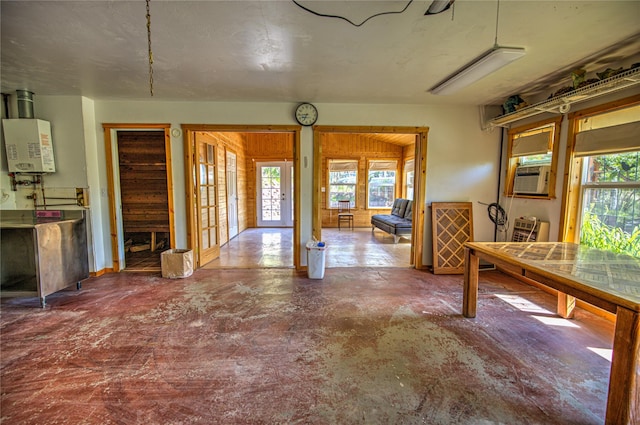 8319 Canyon Ferry Rd, Helena, MT 59602 - entryway featuring water heater, concrete flooring, plenty of natural light, and cooling unit