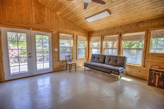 8319 Canyon Ferry Rd, Helena, MT 59602 - living area with plenty of natural light, concrete flooring, lofted ceiling, wood walls, and ceiling fan